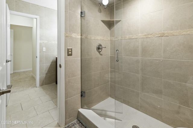 bathroom featuring a stall shower and tile patterned flooring