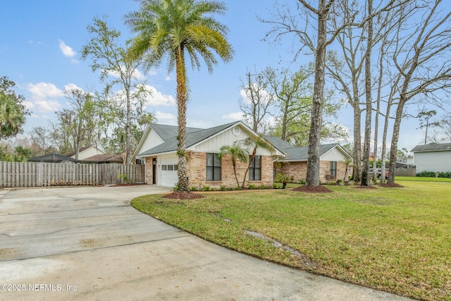 view of front of house featuring a garage, brick siding, fence, concrete driveway, and a front lawn