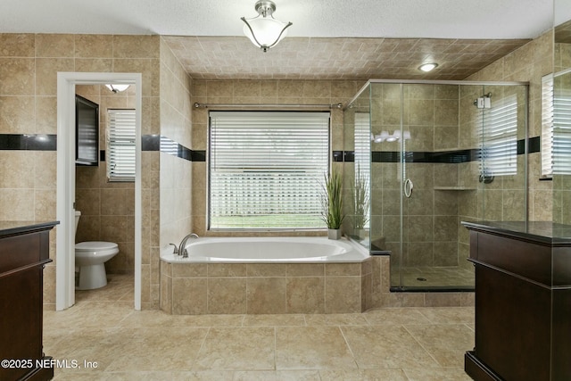 full bath featuring toilet, a shower stall, a bath, and tile walls