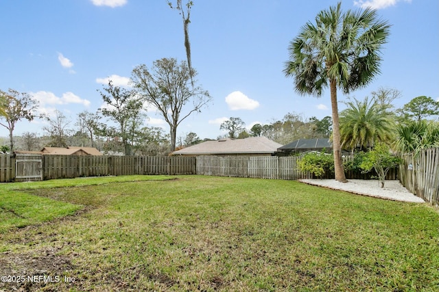 view of yard with a fenced backyard and a patio