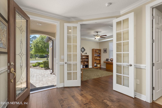 607 Caspia Ln, Ponte Vedra, FL 32081 - entrance foyer with dark wood-type flooring, ceiling fan, french doors, and ornamental molding