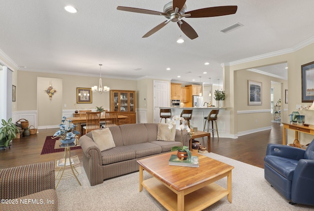 607 Caspia Ln, Ponte Vedra, FL 32081 - living room featuring ornamental molding, ceiling fan with notable chandelier, and wood finished floors