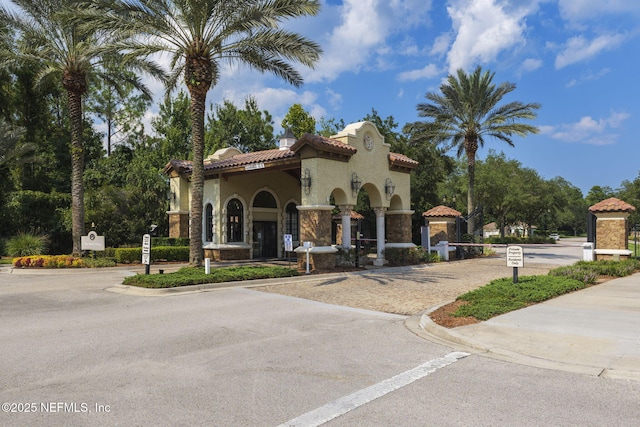 607 Caspia Ln, Ponte Vedra, FL 32081 - view of front of home featuring a tile roof, stucco siding, and stone siding