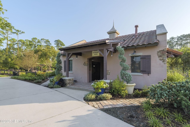 607 Caspia Ln, Ponte Vedra, FL 32081 - view of front of house with stucco siding and a tiled roof