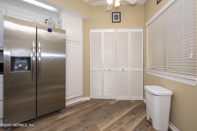 4020 Lavista Cir Unit 207, Jacksonville, FL 32217 - kitchen featuring stainless steel refrigerator with ice dispenser, white cabinetry, ceiling fan, wood finished floors, and baseboards