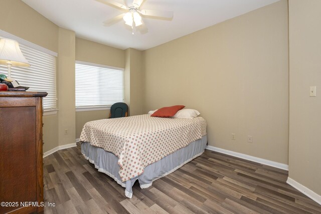 4020 Lavista Cir Unit 207, Jacksonville, FL 32217 - bedroom with ceiling fan, baseboards, and wood finished floors