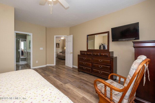 4020 Lavista Cir Unit 207, Jacksonville, FL 32217 - bedroom with ensuite bathroom, ceiling fan, wood finished floors, and baseboards