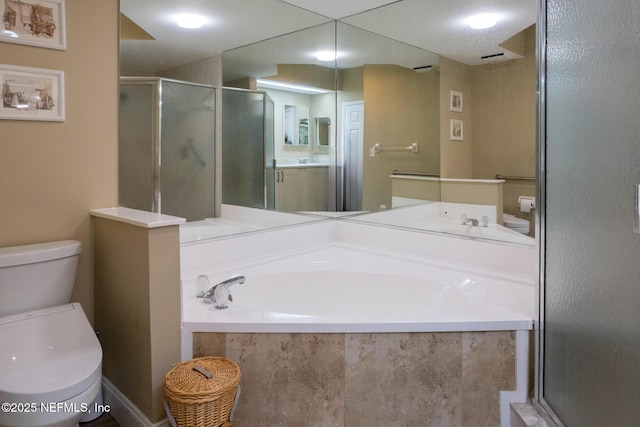4020 Lavista Cir Unit 207, Jacksonville, FL 32217 - full bathroom featuring a stall shower, a garden tub, and toilet