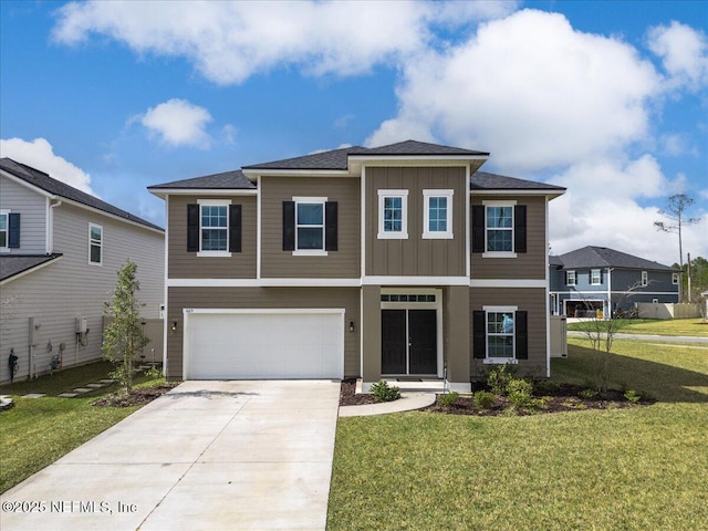 view of front of home featuring a garage, driveway, board and batten siding, and a front yard