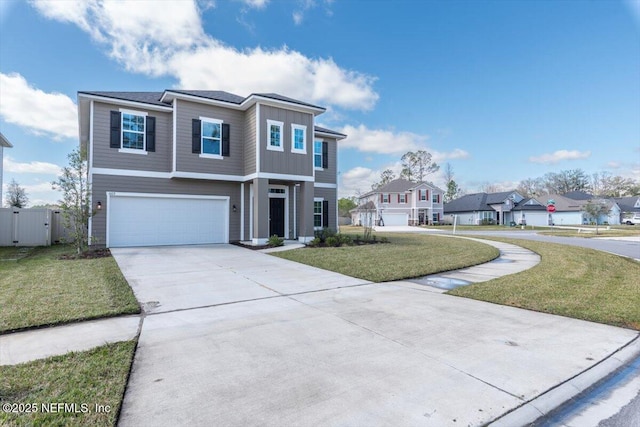 view of front of home featuring driveway, a front lawn, an attached garage, and fence