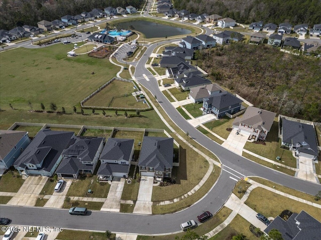 birds eye view of property with a residential view