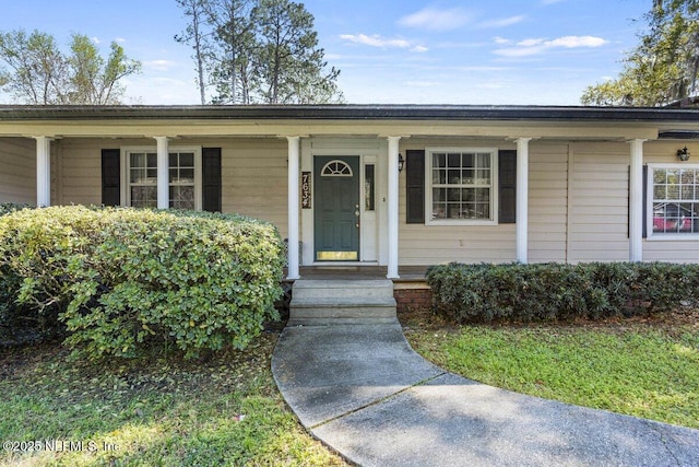 property entrance with covered porch