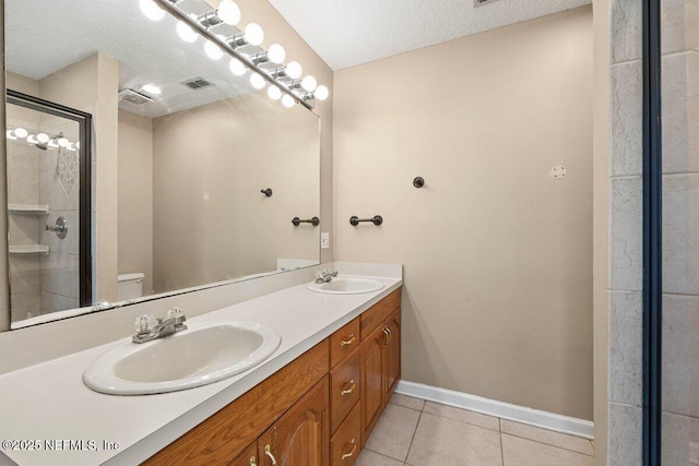 full bathroom with tile patterned floors, toilet, a stall shower, and a sink