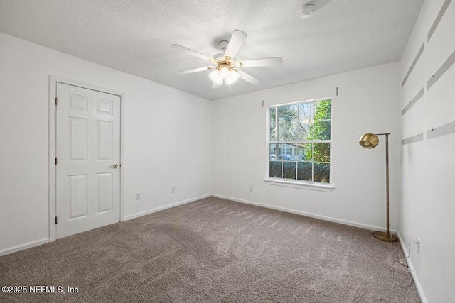 unfurnished bedroom with a ceiling fan, carpet, baseboards, and a textured ceiling