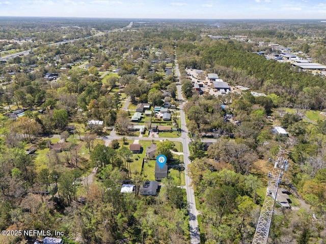 bird's eye view featuring a wooded view