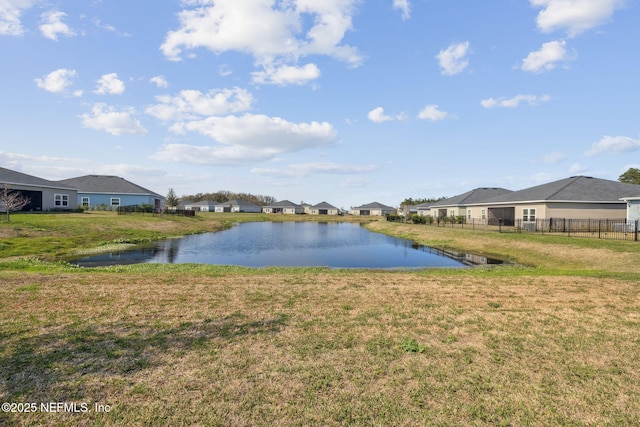 view of water feature featuring fence and a residential view