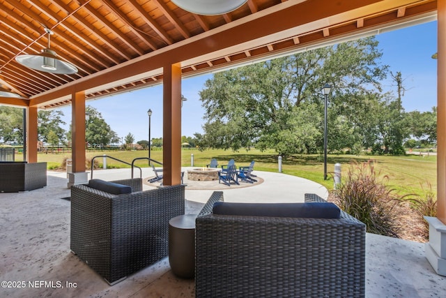 view of patio / terrace featuring an outdoor fire pit and ceiling fan