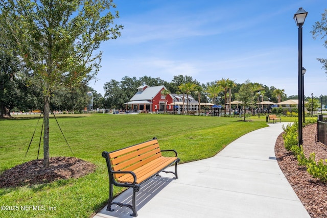 view of property's community with a yard