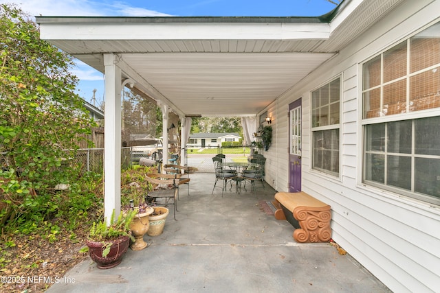 view of patio featuring fence