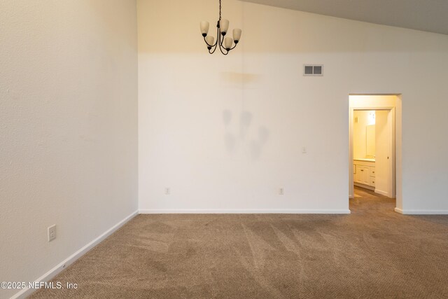 4908 Key Lime Dr Unit 301, Jacksonville, FL 32256 - carpeted empty room featuring a notable chandelier, visible vents, baseboards, and vaulted ceiling