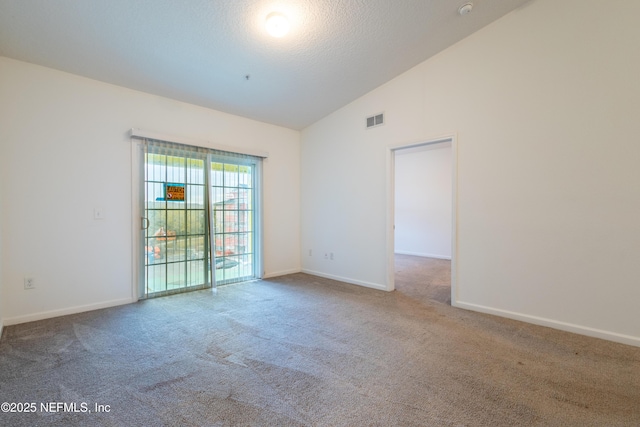 4908 Key Lime Dr Unit 301, Jacksonville, FL 32256 - spare room with baseboards, visible vents, high vaulted ceiling, carpet floors, and a textured ceiling