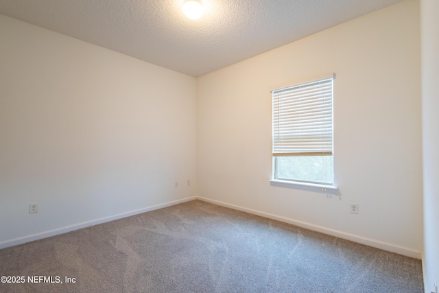 4908 Key Lime Dr Unit 301, Jacksonville, FL 32256 - empty room featuring carpet, baseboards, and a textured ceiling