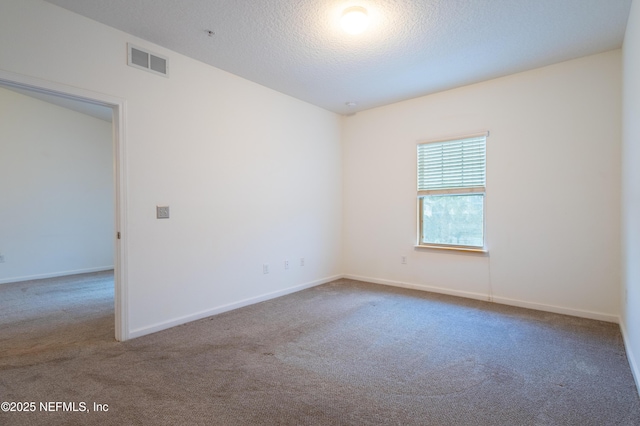 4908 Key Lime Dr Unit 301, Jacksonville, FL 32256 - carpeted empty room featuring visible vents, a textured ceiling, and baseboards