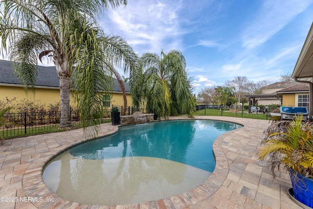 view of swimming pool featuring fence, grilling area, a fenced in pool, and a patio