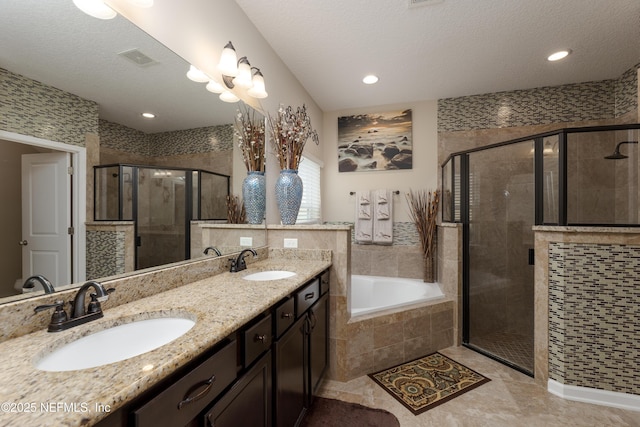 full bath featuring a stall shower, visible vents, and a sink