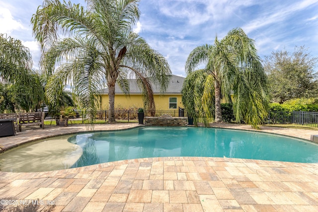 view of pool with fence, a fenced in pool, and a patio