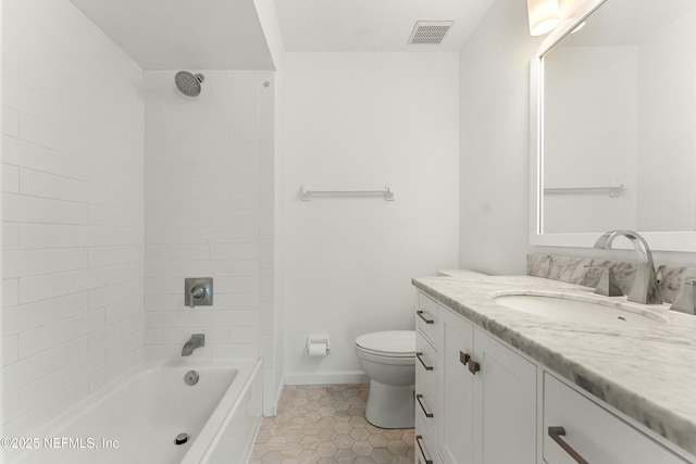 bathroom featuring bathing tub / shower combination, visible vents, toilet, vanity, and tile patterned flooring