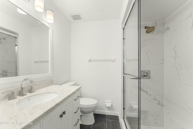 full bathroom featuring a shower stall and toilet