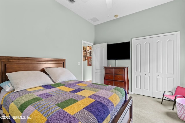 bedroom featuring carpet, a closet, ceiling fan, and lofted ceiling