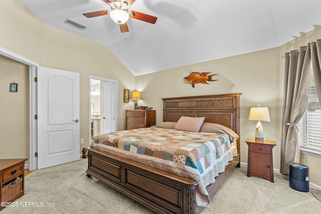 bedroom featuring light carpet, ceiling fan, visible vents, and lofted ceiling