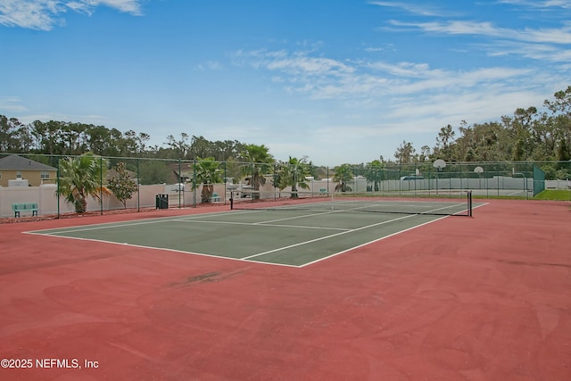 view of sport court featuring fence