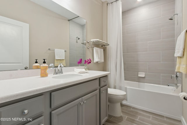 bathroom featuring vanity, toilet, and shower / tub combo with curtain