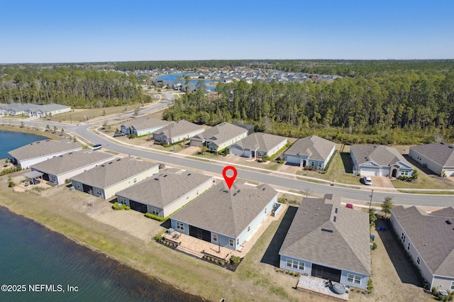 birds eye view of property featuring a residential view and a water view