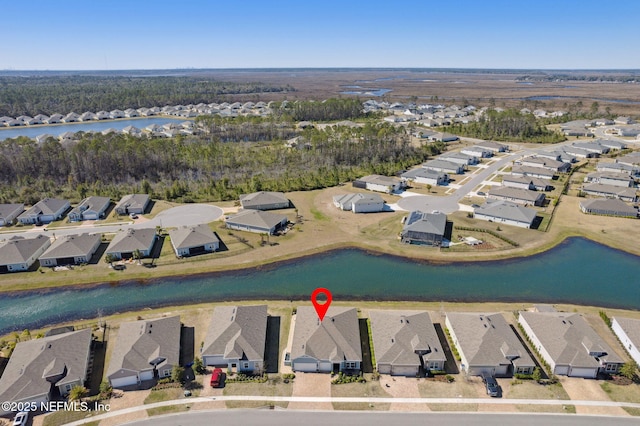 aerial view with a water view and a residential view