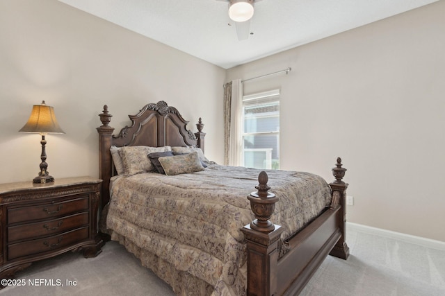 bedroom with baseboards, ceiling fan, and light colored carpet