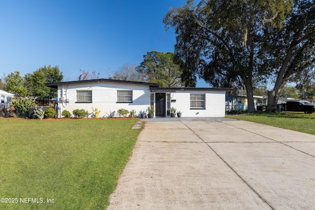 ranch-style home featuring a front yard and fence