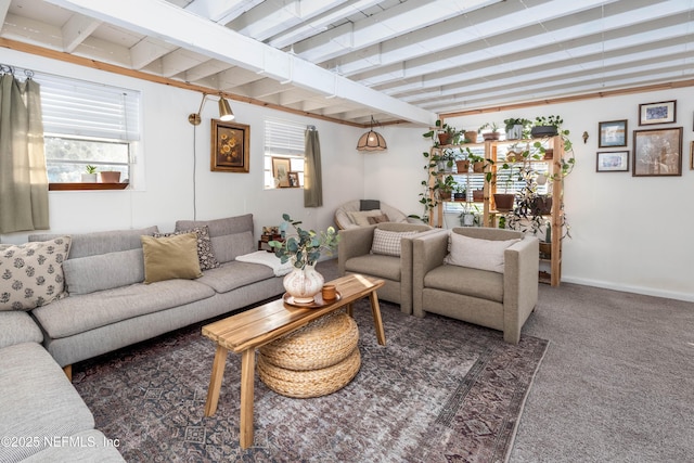 living area featuring beam ceiling, baseboards, and carpet flooring