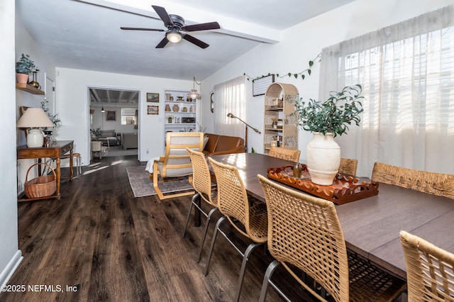 dining space with a ceiling fan and wood finished floors