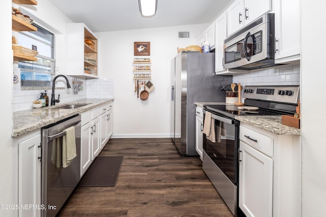 kitchen with stainless steel appliances, a sink, white cabinets, open shelves, and dark wood finished floors