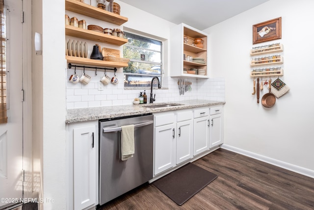 kitchen featuring dark wood-style floors, open shelves, decorative backsplash, a sink, and dishwasher