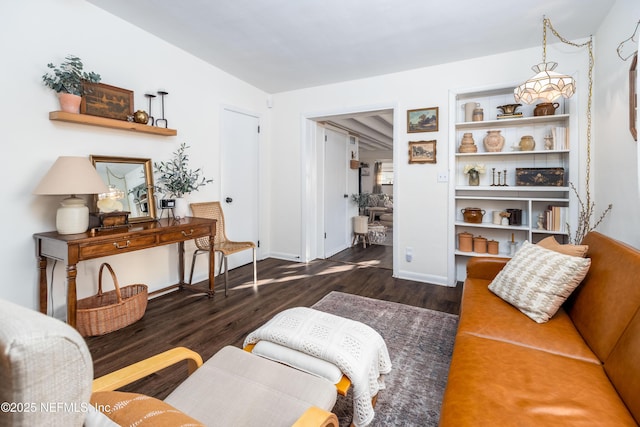 living room with baseboards and wood finished floors