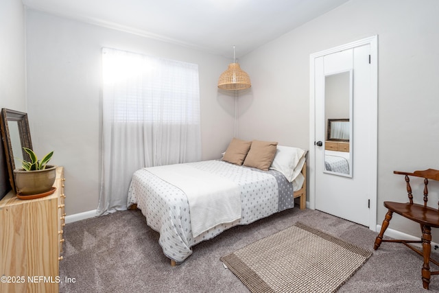 carpeted bedroom with baseboards