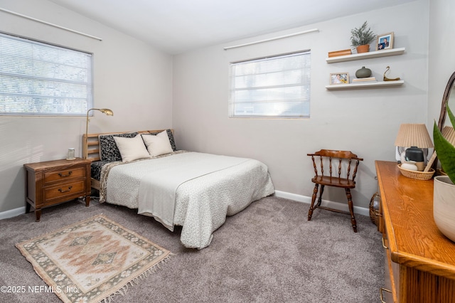 carpeted bedroom with baseboards