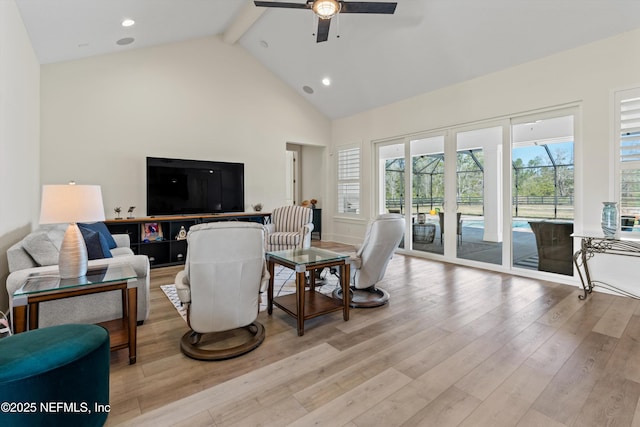 living room featuring high vaulted ceiling, recessed lighting, a ceiling fan, beam ceiling, and light wood finished floors