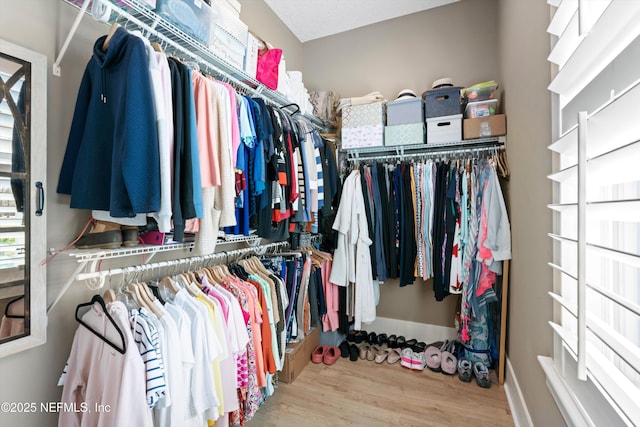 spacious closet with wood finished floors