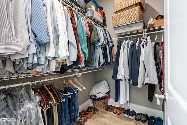 spacious closet with wood finished floors